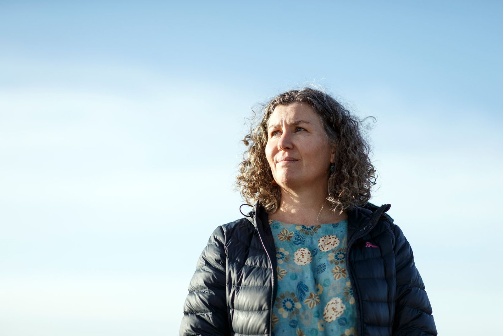 Image of a women with blue sky background