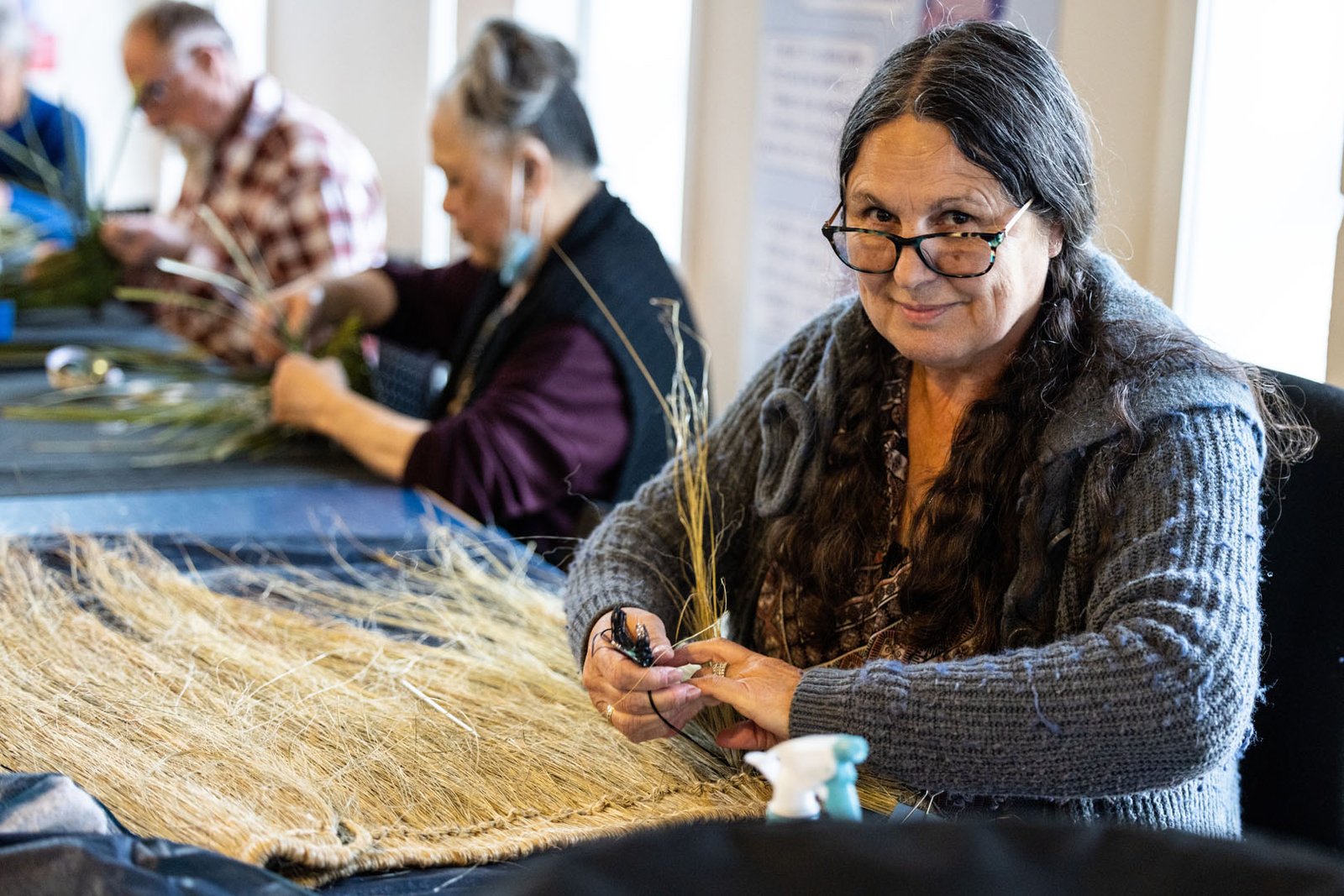 Image of a women making a flax skirt