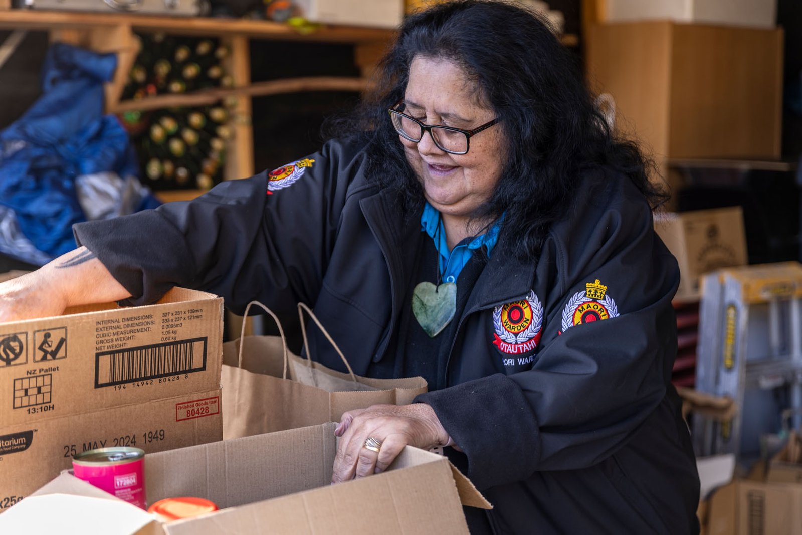 Image of a women packing food in boxes